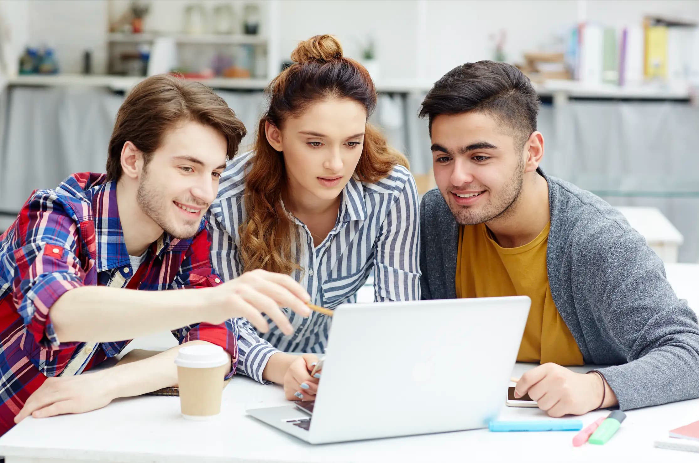 A person working on a laptop in a modern office setting